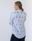 Pale blue organic cotton women's shirt. View from the back.